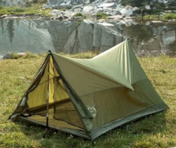 rain camping in a poncho